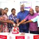Theophilus Yartey (3rd from right), Editor, Graphic; Dr Charles Nii Ayiku Ayiku (2nd from right), General Manager in charge of External Relations, ECG; Samuel Doe Ablordeppey (left), News Editor, Daily Graphic; Grace Garshong (4th from left), Communications Specialist, ECG, and some staff of GCGL and ECG cutting a cake to celebrate Graphic’s 75th anniversary. Picture: GCGL